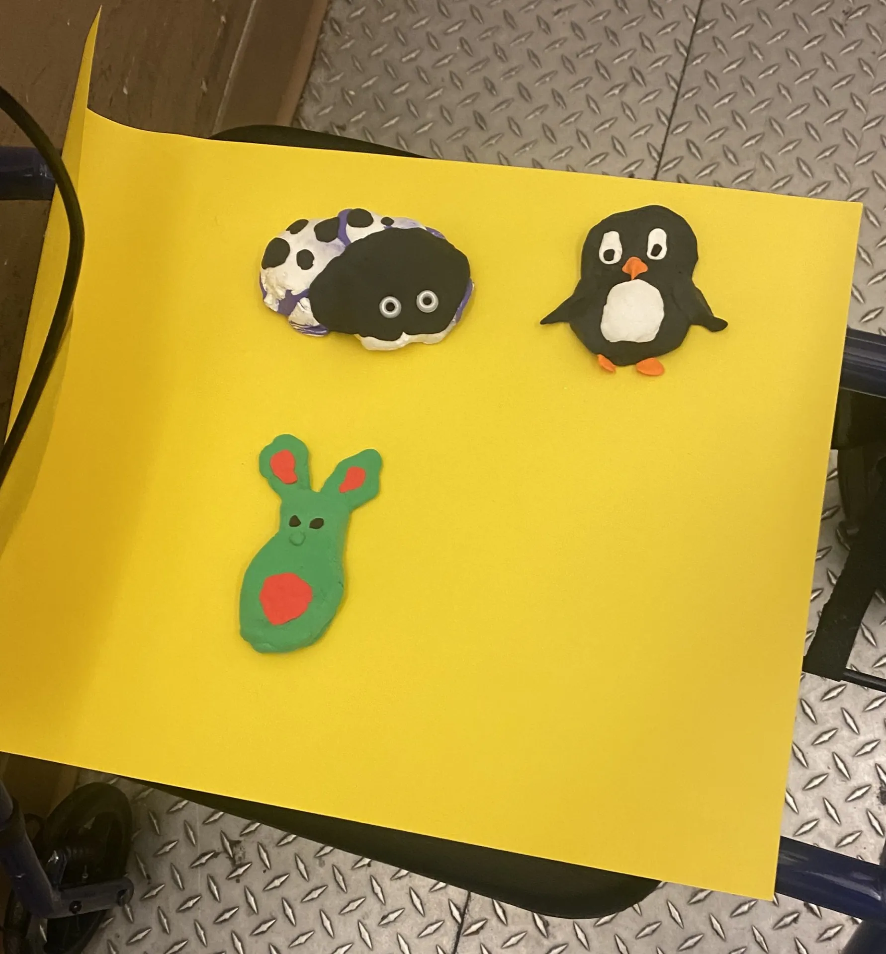 Clay figures made at the Arts and Crafts Fair. it depicts a penguin, a bug, and a bunny.